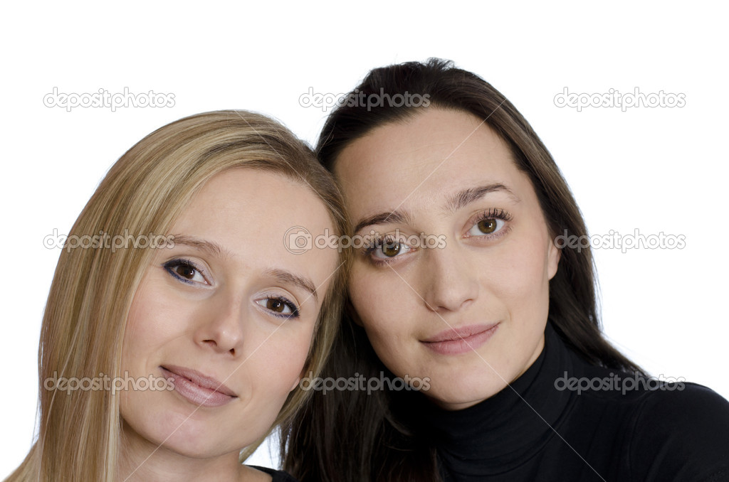 two girls smiling on a white background
