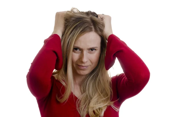 Mujer tirando de su pelo sobre fondo blanco —  Fotos de Stock