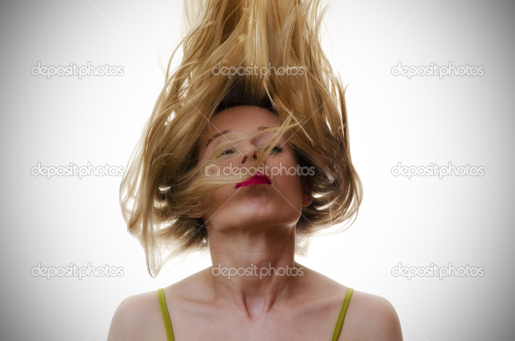woman with hair flying in the air