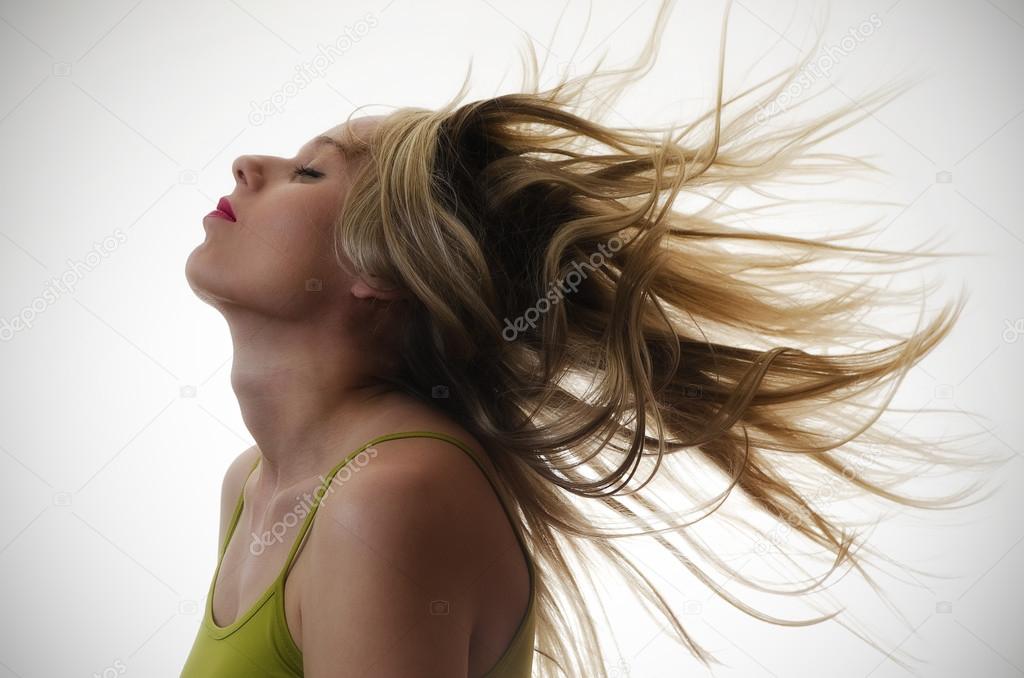 woman with hair flying in the air