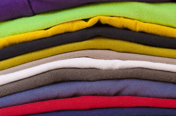 Close up of stack of folded clothes — Stock Photo, Image
