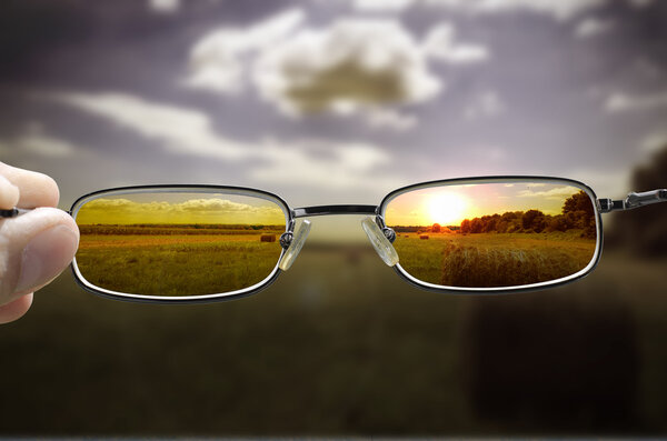 Seeing sunset through glasses