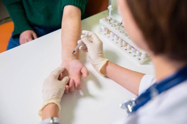 The doctor takes tests from the patient for allergies. Healthcare. Medicine