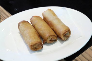 The Chinese deep fried food named Dim Sum served in the dishes.