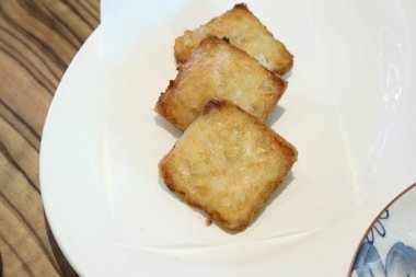 The Chinese deep fried food named Dim Sum served in the dishes.