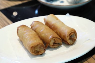 The Chinese deep fried food named Dim Sum served in the dishes.