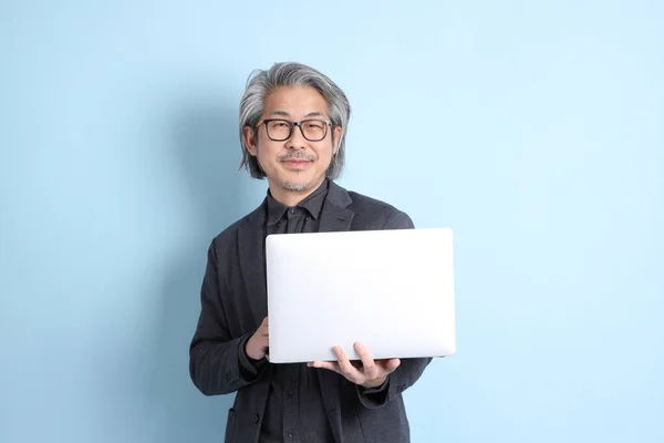 Senior Asian Businessman Standing Blue Background — Stockfoto