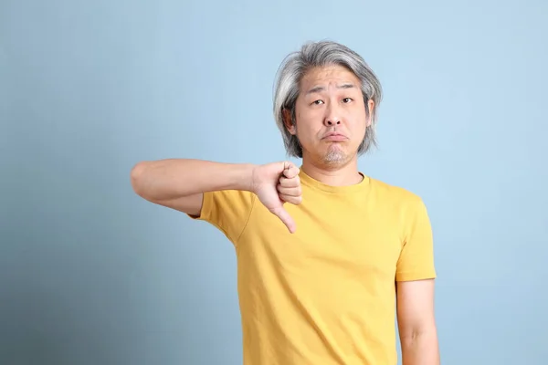 Senior Asian Man Yellow Shirt Standing Blue Background — Stock Photo, Image