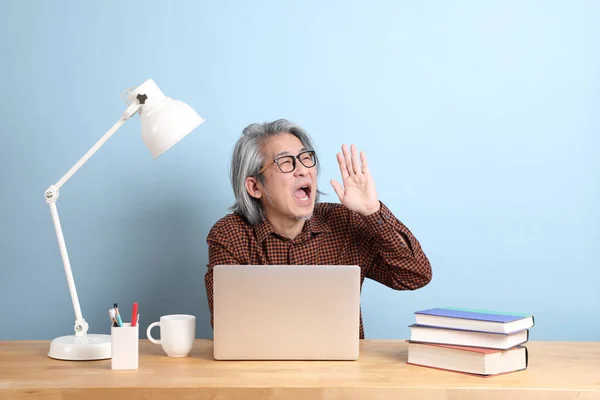 Senior Asian Man Working Laptop Desk Blue Background — Fotografia de Stock