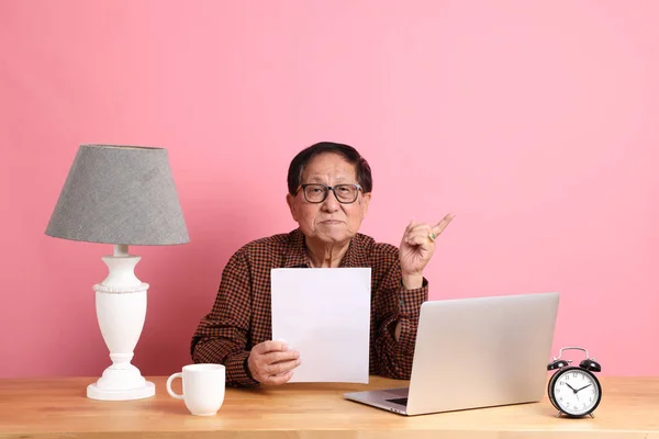 Senior Asian Man Sitting Working Desk Laptop Pink Background — Foto Stock