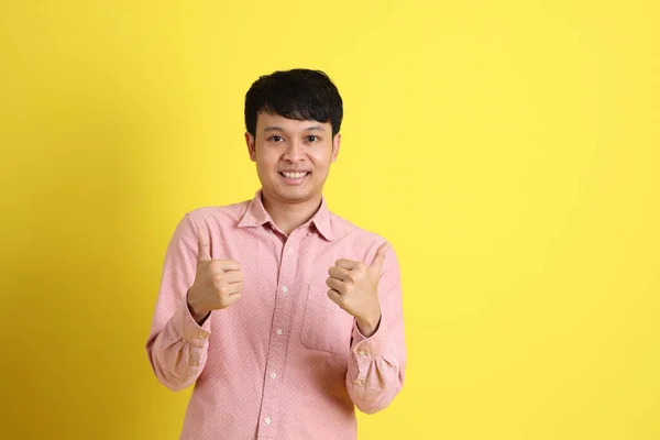 Asian Man Pink Shirt Standing Yellow Background — Stock Photo, Image