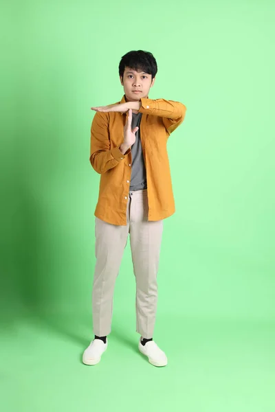 Young Adult Asian Man Smart Casual Clothes Standing Light Green — Stock Photo, Image