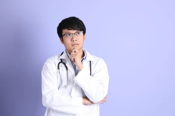 Young Adult Asian Physician Standing Purple Background — Stock Photo, Image