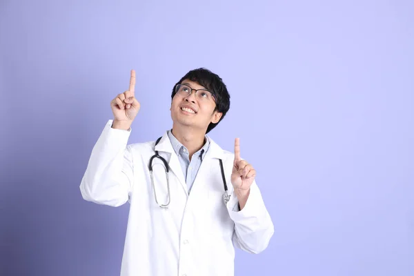 Young Adult Asian Physician Standing Purple Background — ストック写真