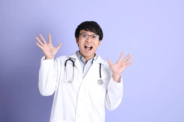 Young Adult Asian Physician Standing Purple Background — ストック写真