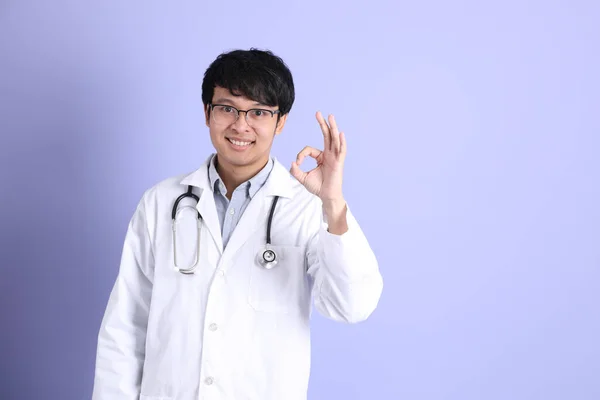 Young Adult Asian Physician Standing Purple Background — ストック写真