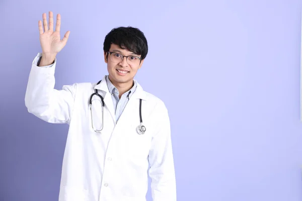 Young Adult Asian Physician Standing Purple Background — ストック写真