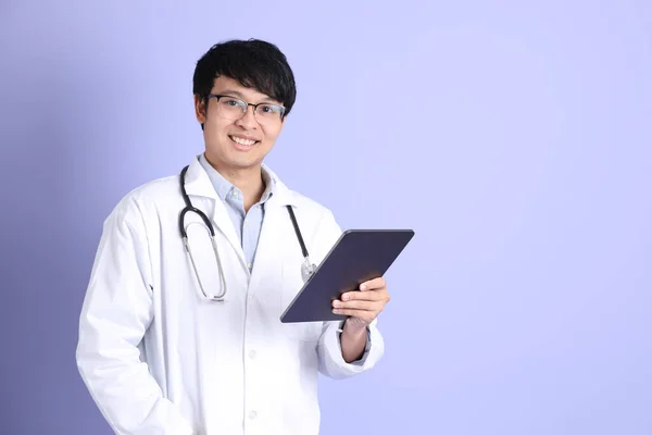 Young Adult Asian Physician Standing Purple Background — ストック写真