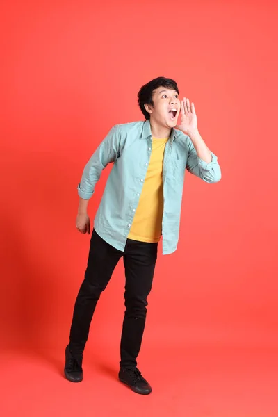 Young Adult Southeast Asian Man Green Shirt Standing Orange Background — Stock Photo, Image