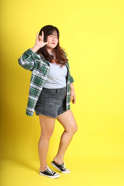 Chubby Asian Woman Standing Yellow Background Casual Clothes — kuvapankkivalokuva