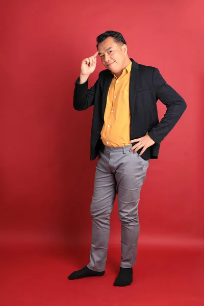 Asian Middle Aged Man Standing Red Background — Stockfoto