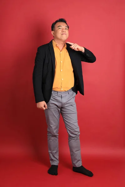 Asian Middle Aged Man Standing Red Background — Stockfoto