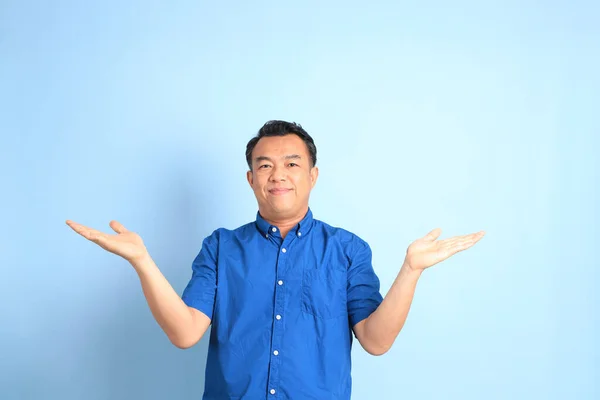 Asian Middle Aged Man Blue Shirt Standing Blue Background — Stockfoto