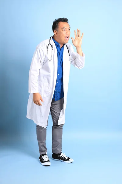 Senior Asian Physician Standing Blue Background — 스톡 사진