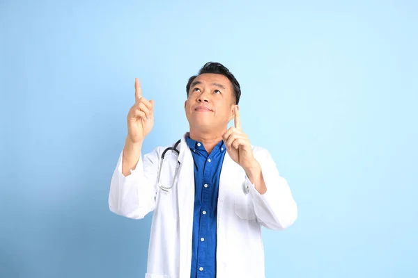 Senior Asian Physician Standing Blue Background — 스톡 사진