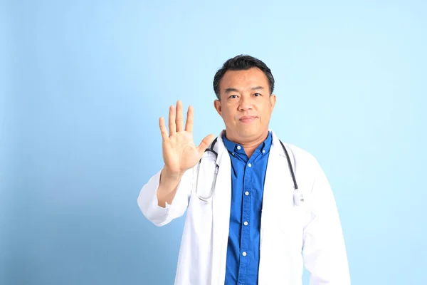 Senior Asian Physician Standing Blue Background — ストック写真