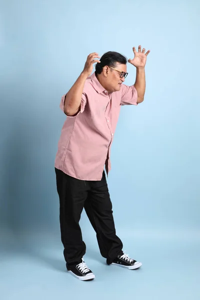 Adult Asian Man Pink Shirt Standing Blue Background — 스톡 사진
