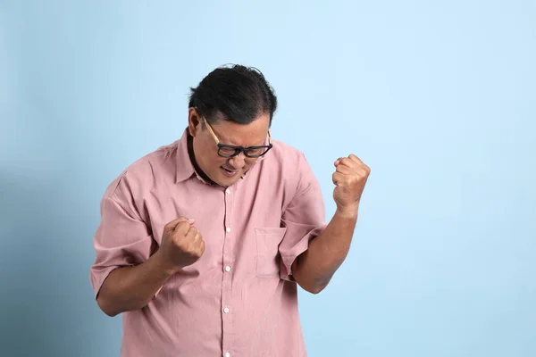 Adult Asian Man Pink Shirt Standing Blue Background — Stok fotoğraf