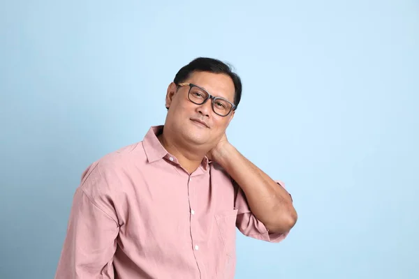 Adult Asian Man Pink Shirt Standing Blue Background — Stockfoto