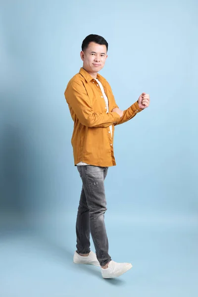 Asian Lgbtq Man Yellow Shirt Standing Blue Background — Stock Fotó