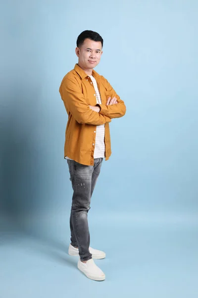 Asian Lgbtq Man Yellow Shirt Standing Blue Background — Stock Fotó