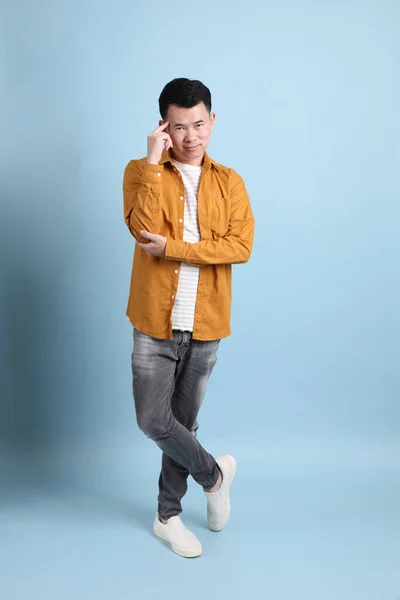 Asian Lgbtq Man Yellow Shirt Standing Blue Background — 스톡 사진