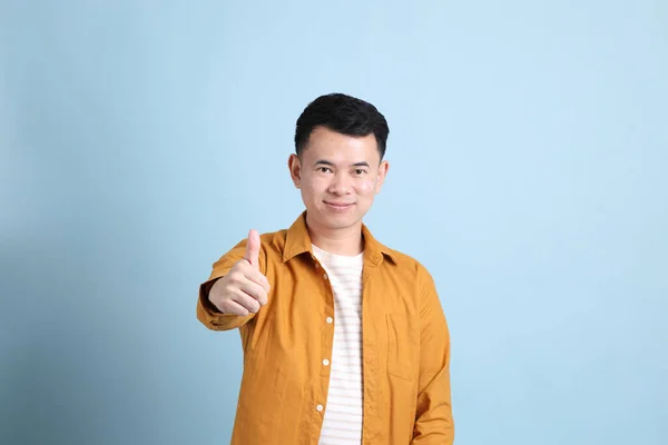 Asian Lgbtq Man Yellow Shirt Standing Blue Background — 스톡 사진