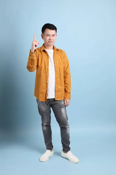 Asian Lgbtq Man Yellow Shirt Standing Blue Background — Zdjęcie stockowe