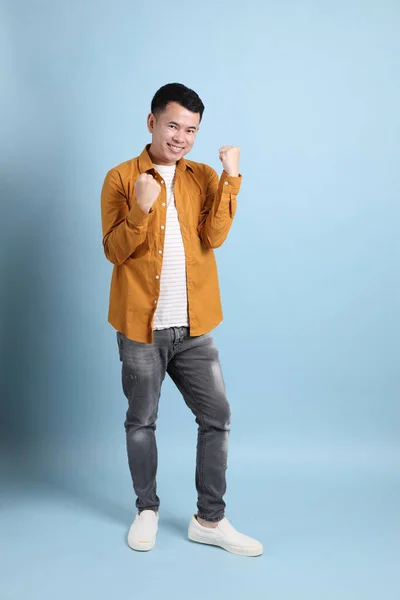 Asian Lgbtq Man Yellow Shirt Standing Blue Background — Stockfoto