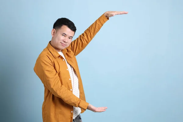 Asian Lgbtq Man Yellow Shirt Standing Blue Background — 스톡 사진