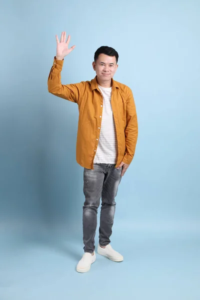 Asian Lgbtq Man Yellow Shirt Standing Blue Background — Stock Fotó