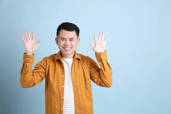 Asian Lgbtq Man Yellow Shirt Standing Blue Background — Stok fotoğraf