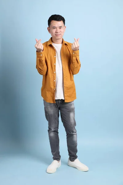 Asian Lgbtq Man Yellow Shirt Standing Blue Background — 스톡 사진