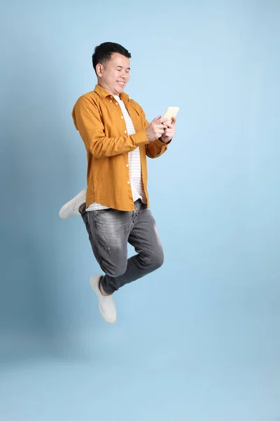 Asian Lgbtq Man Yellow Shirt Standing Blue Background — Foto de Stock