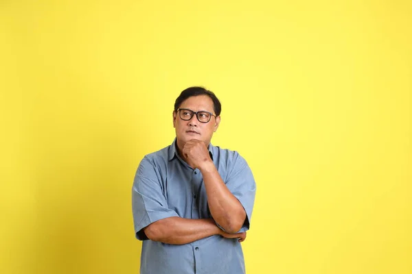 Adult Asian Man Blue Shirt Standing Yellow Background — Stockfoto