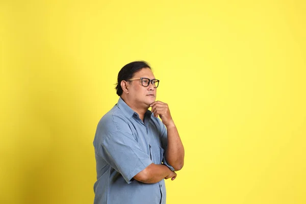 Adult Asian Man Blue Shirt Standing Yellow Background — Stok fotoğraf