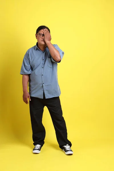 Adult Asian Man Blue Shirt Standing Yellow Background — ストック写真