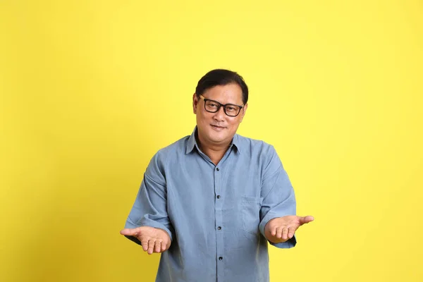 Adult Asian Man Blue Shirt Standing Yellow Background — Stockfoto