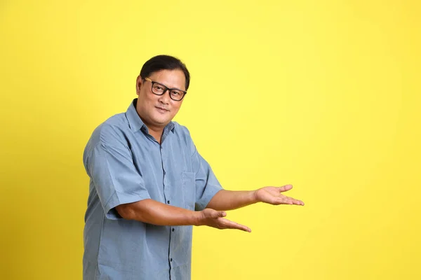 Adult Asian Man Blue Shirt Standing Yellow Background — Stok fotoğraf