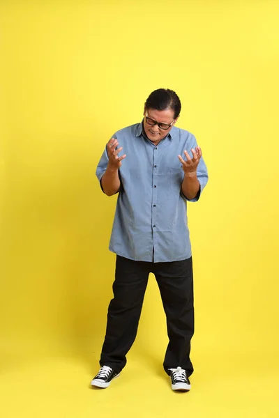 Adult Asian Man Blue Shirt Standing Yellow Background — 스톡 사진